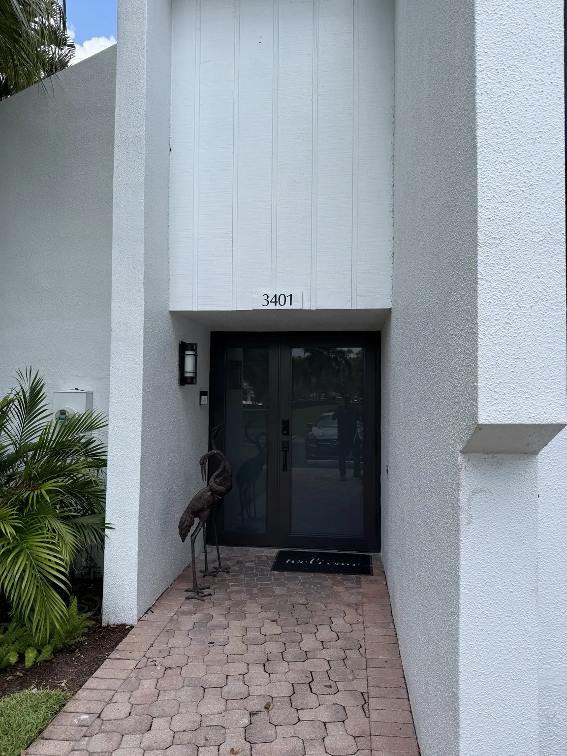 Completed modern black impact front entry door